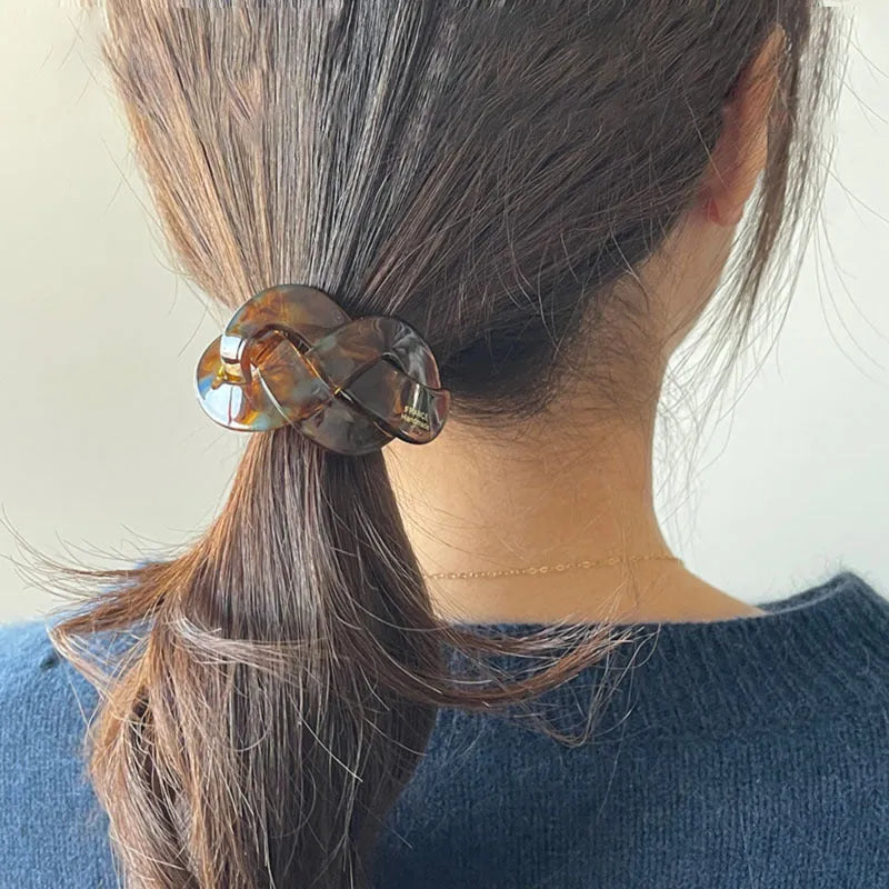 Seamless acetate hair rope ring in black, plaid, caramel, and dark coffee colours.