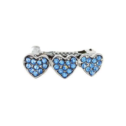 A 3cm long peach heart shaped hair clip with rhinestones and a small dog charm, on a white background.