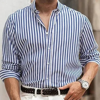 Man modelling a khaki and white striped loose-fit long sleeve casual button shirt.