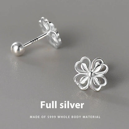 Elegant sterling silver stud earrings with delicate floral accents, suitable for both men and women