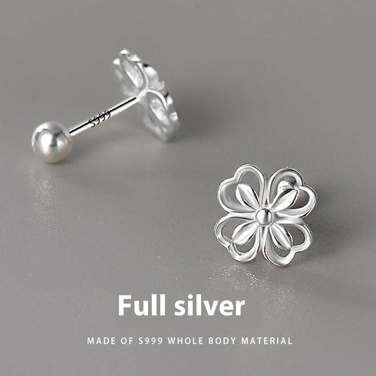 Elegant sterling silver stud earrings with delicate floral accents, suitable for both men and women