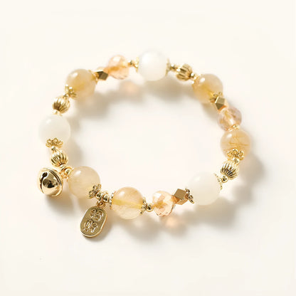 Gold electroplated bracelet with a rutilated quartz charm in Lucky Fortune colour.