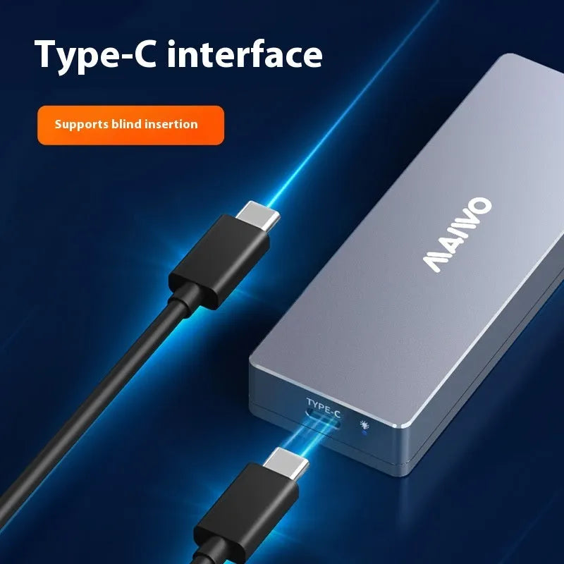 Silver Type-C M.2 SSD hard drive enclosure with screwdriver and accessories on a table