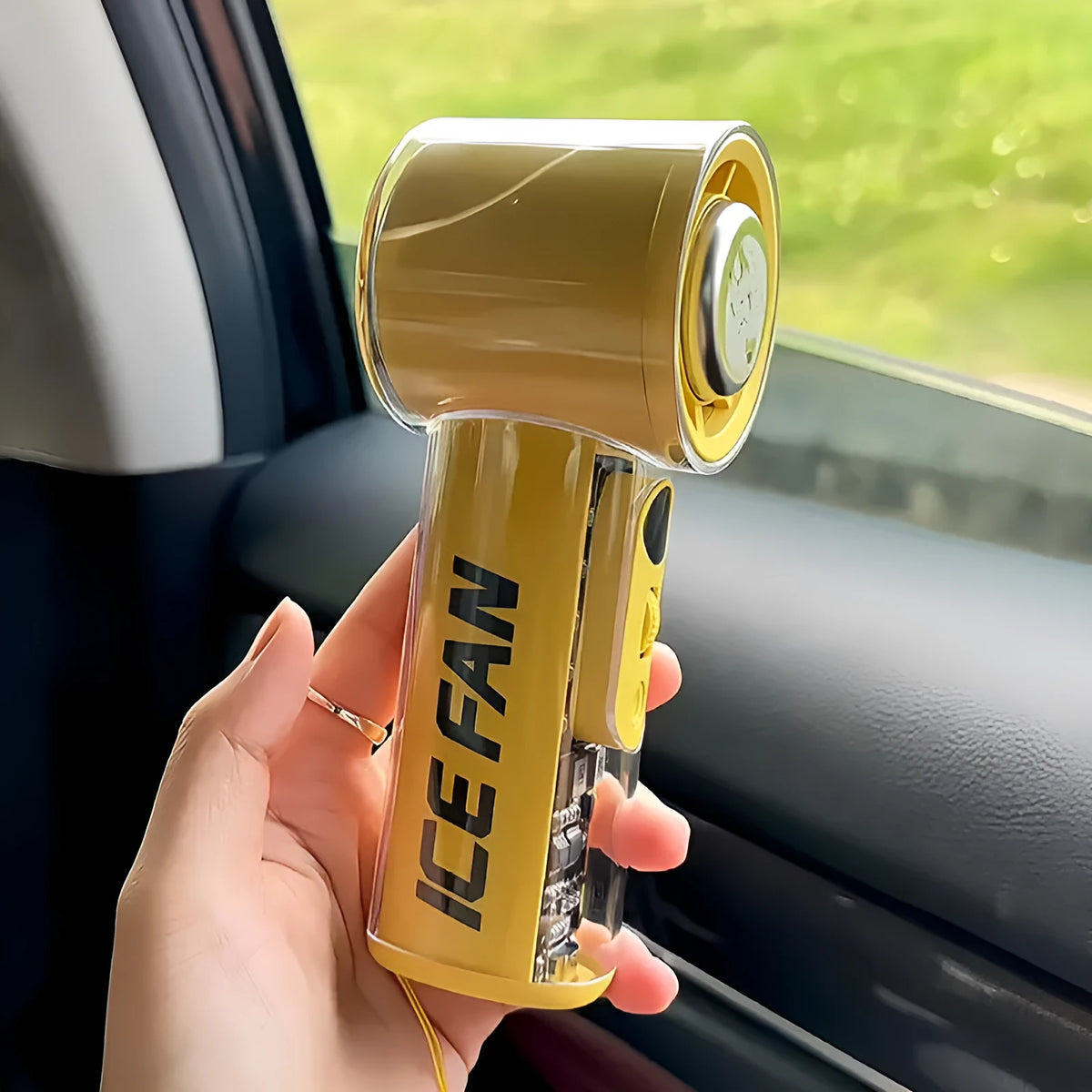 Small handheld refrigeration fan with ice compress function in black, white, or yellow colour.