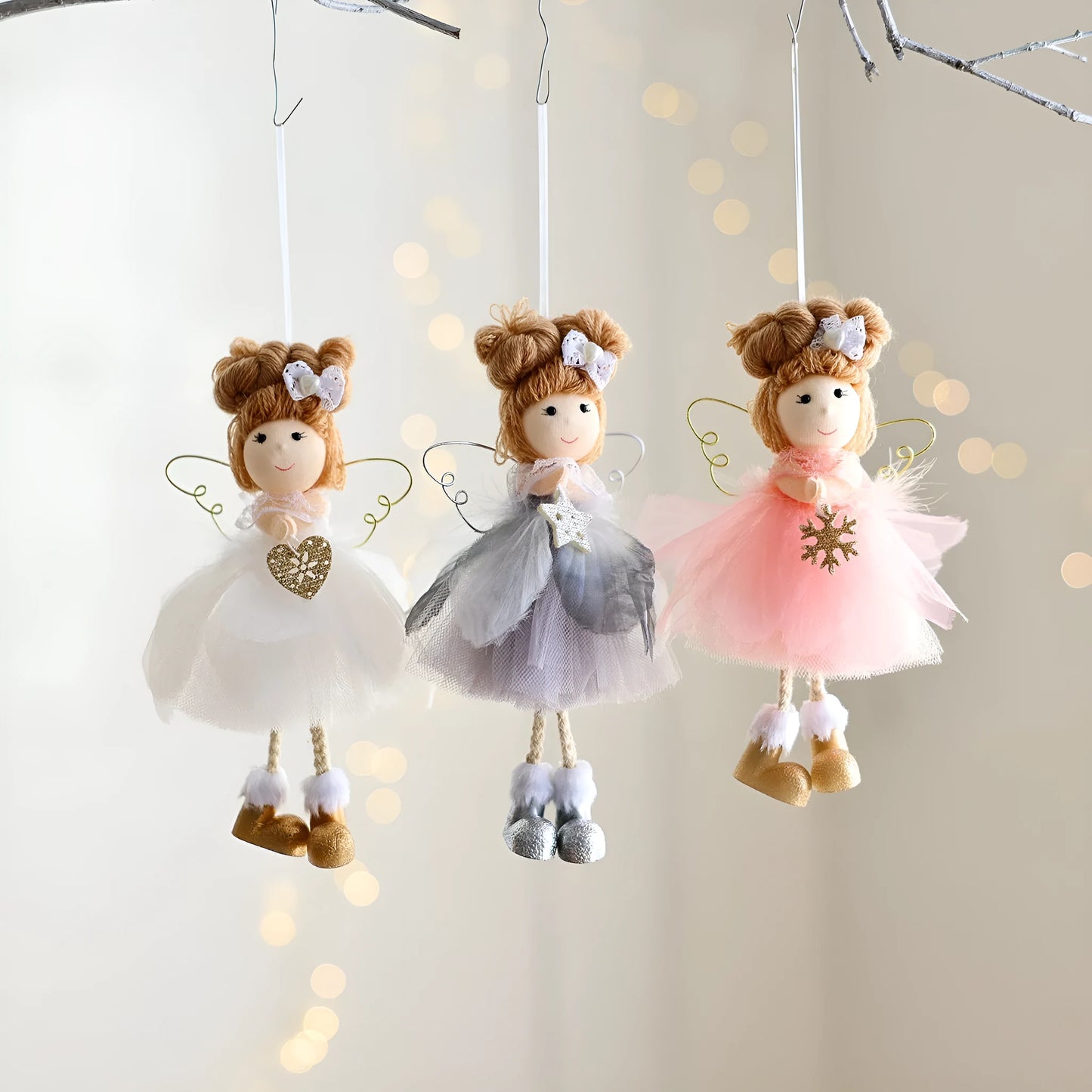 White mesh angel girl Christmas ornament with snowflake detail hanging demonstration