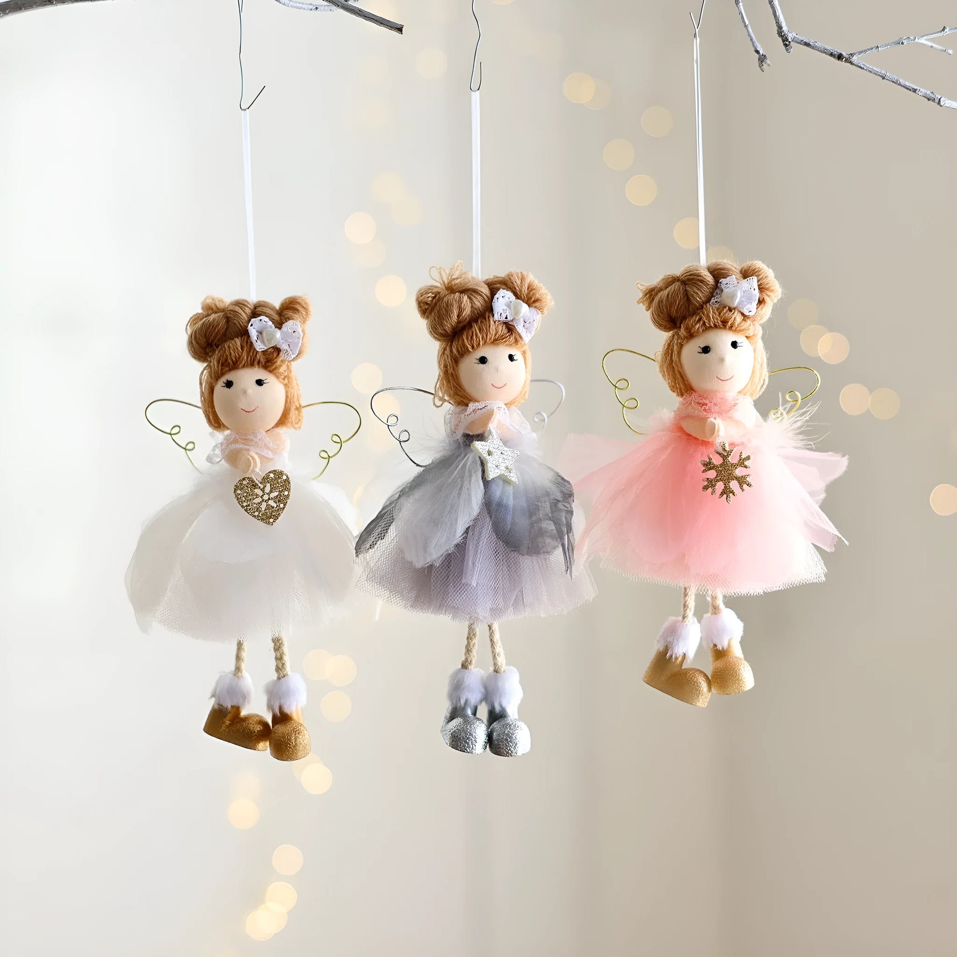 White mesh angel girl Christmas ornament with snowflake detail hanging demonstration