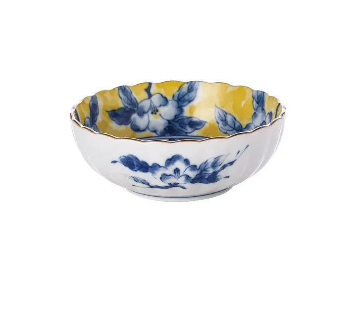 Yellow ceramic tableware set with colourful floral patterns, includes bowls and plates in Japanese style