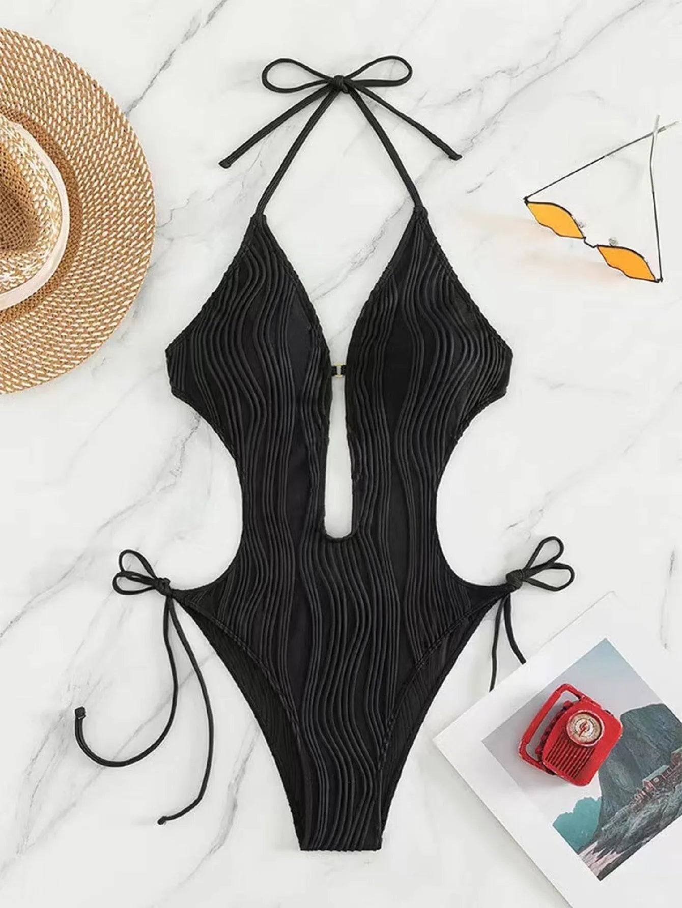 Women's black lace-up triangle bikini swimsuit made from polyester fabric