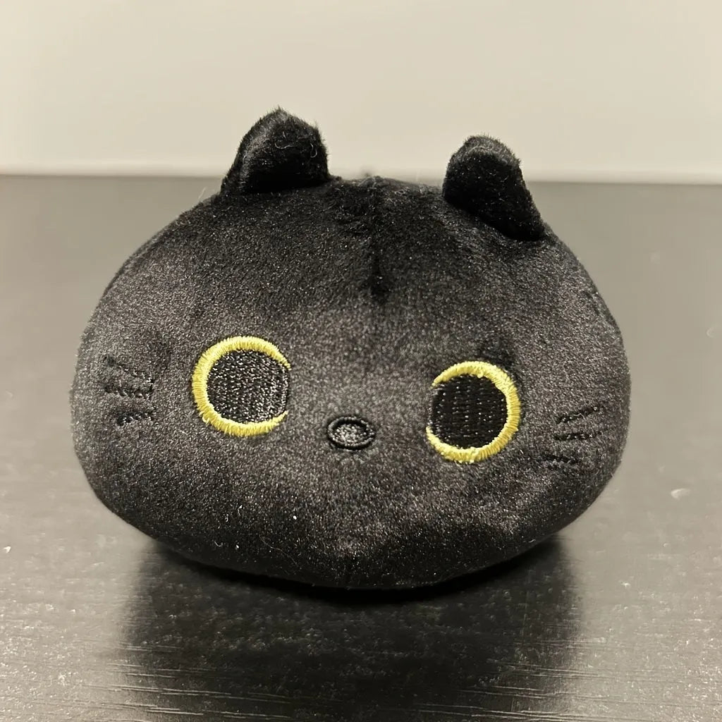 Black cat plush toy pillow with fluffy texture and embroidered facial features