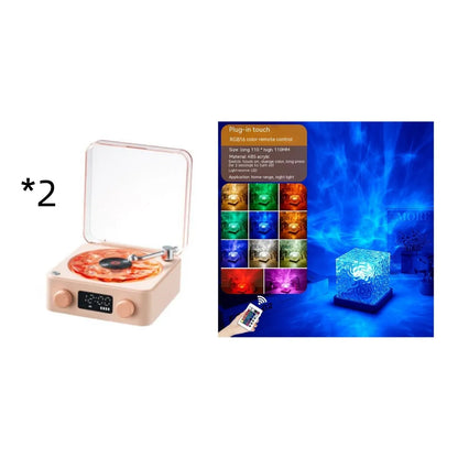 Retro-style turntable Bluetooth speaker with glowing RGB light projection on a wooden surface.