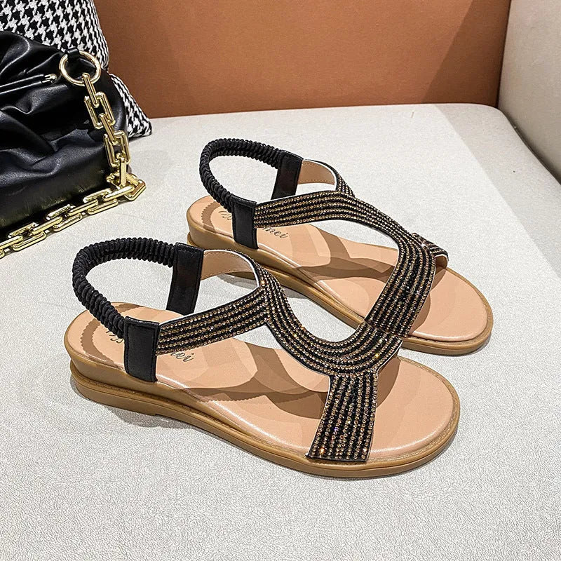 Women's patent leather beach sandals with rhinestone decoration and non-slip soles in gold colour