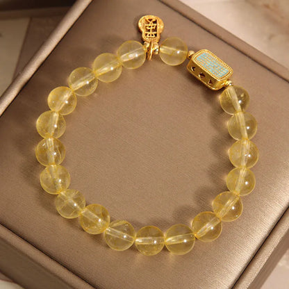 Women's natural yellow citrine crystal bracelet with rhinestone detailing.