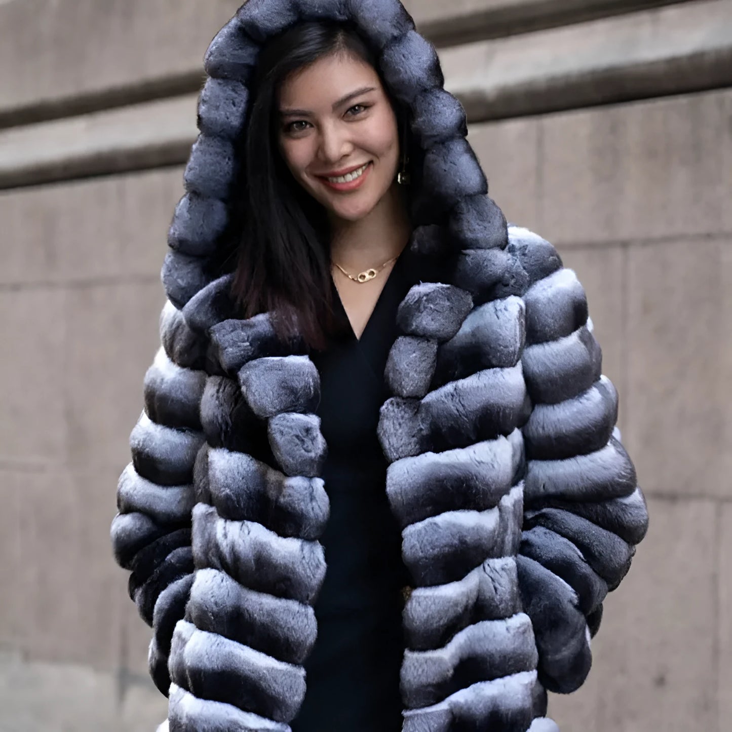Women's zebra stripe pattern faux fur overcoat with regular sleeves, shown in a medium length.