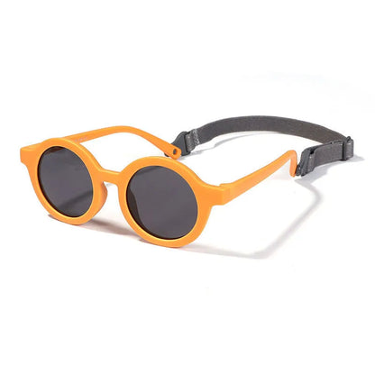 Children's round-frame polarised sunglasses with soft TPEE frame for ages 0-3, shown in assorted colours.
