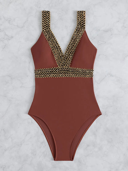 Women's deep V neck one-piece swimsuit with spaghetti straps in printed polyester fabric.