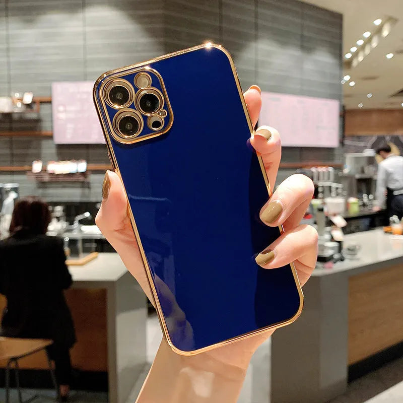 Gold-accented iPhone case with raised silicone stripes on a solid coloured TPU background.