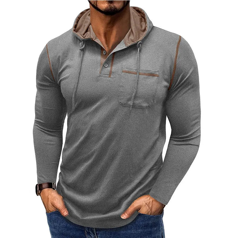Man wearing a grey hooded henley long-sleeved t-shirt, showcasing the pullover style and cotton blend fabric.