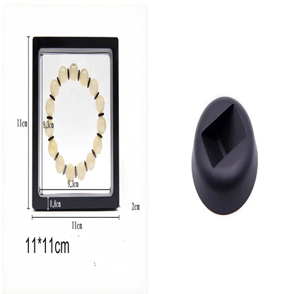 Black 11x11cm suspended 3D floating display frame holding a coin, with square base for stable collectible showcase