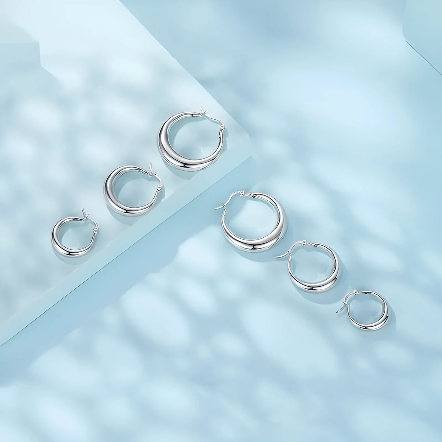 Copper geometric ring ear clip earrings in three sizes with electroplated finish