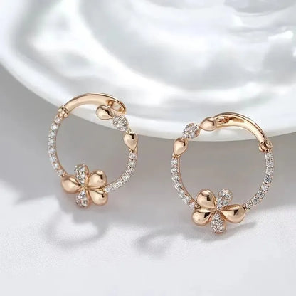 A pair of round ring earrings for women made from electroplated copper with a geometric design.