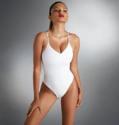 A stylish, backless one-piece swimsuit in a variety of vibrant colors for women's summer fashion.