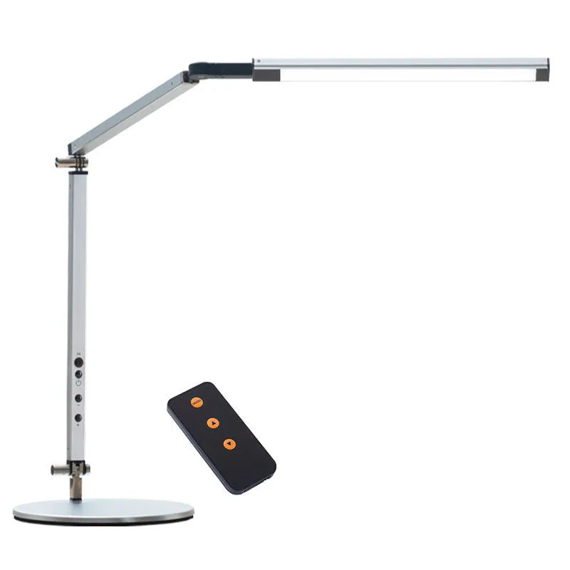 Adjustable aluminium desk lamp with remote control, shown in black with a clip attached to a desk edge.