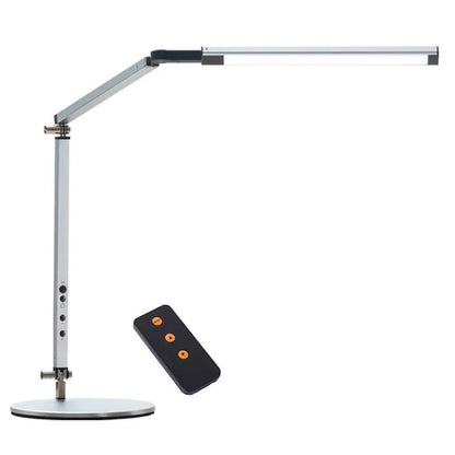 Adjustable aluminium desk lamp with remote control, shown in black with a clip attached to a desk edge.