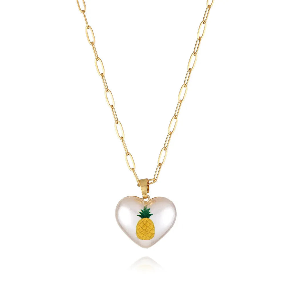 Geometric fruit heart pendant necklace on an adjustable chain, showing strawberry, pineapple, apple, pear, and cherry design options.
