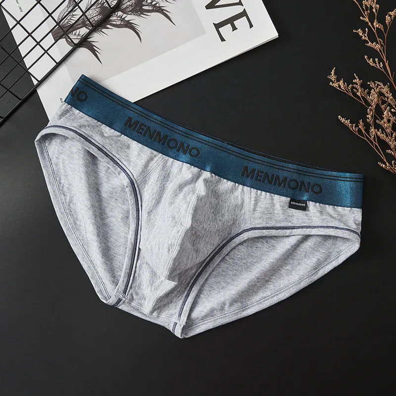 Men's low waist briefs made from cotton fabric, available in a range of dual-tone colours including white/green and black/red, in sizes from M to XXL for a comfortable, breathable fit suitable for year-round wear.