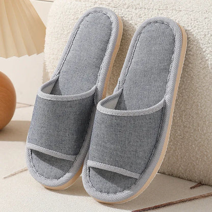 Women's open-toe linen slippers with thick sole in light brown colour.