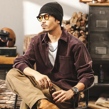 Men's red corduroy loose-fit shirt jacket with long sleeves, showing front view.