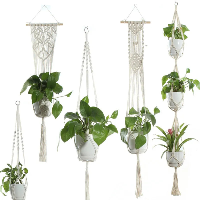 Handmade beige cotton rope net bag holding a plant pot, showing its textured sling design.