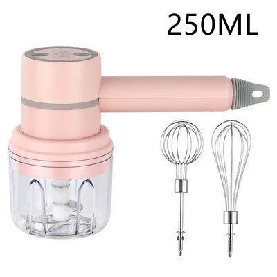 Green rechargeable electric hand mixer with whisk and beater attachments on a kitchen counter