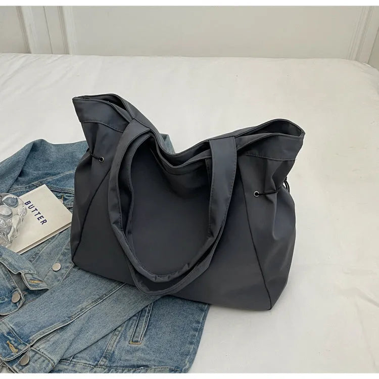 Soft Oxford cloth foldable commuter tote bag in street trend style, shown in available colours.
