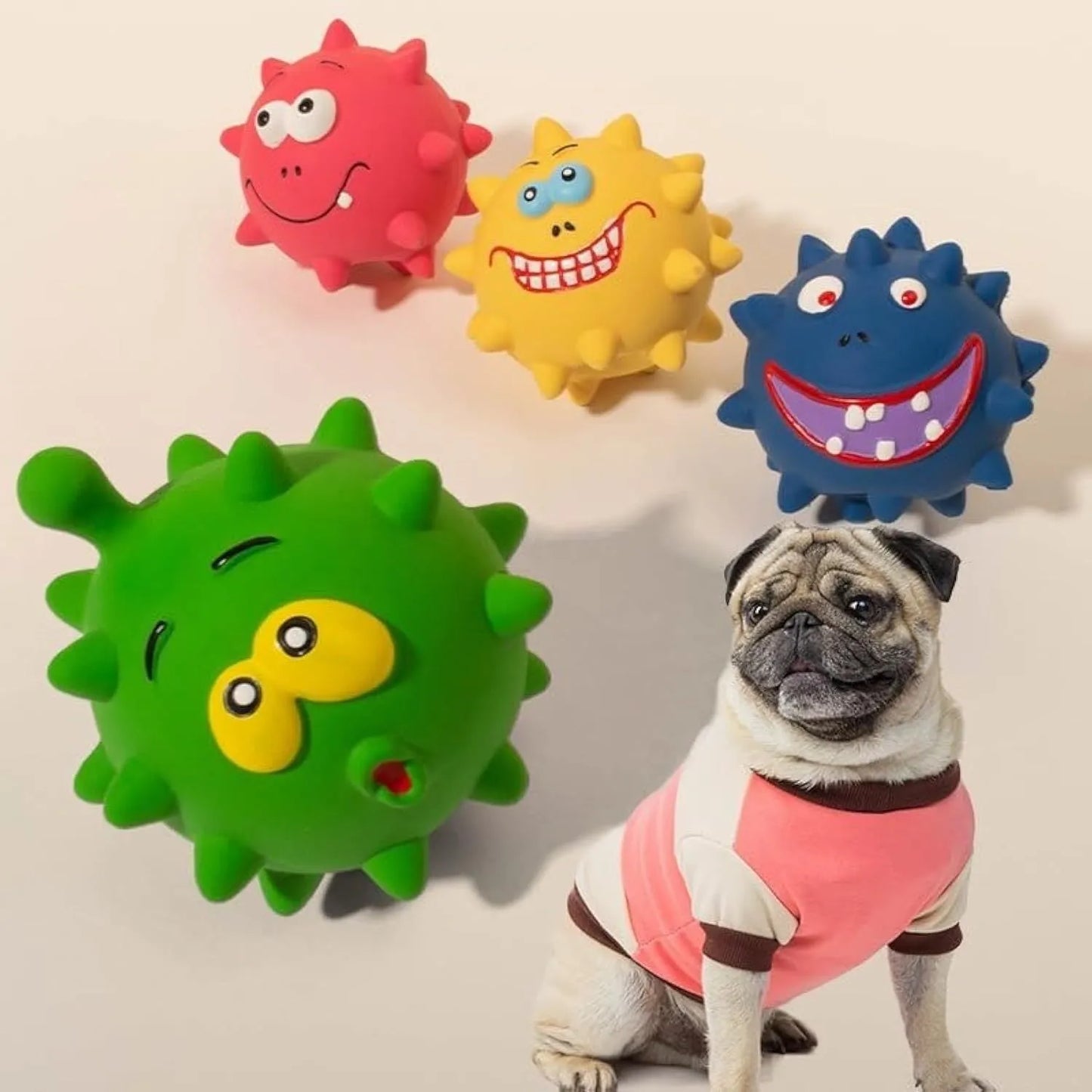 Four natural latex dog squeaky toys with bumpy surfaces and cute faces in blue, green, red, and yellow colours