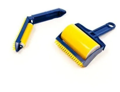 Green and yellow washable adhesive lint rollers for pet hair removal on a fabric background.