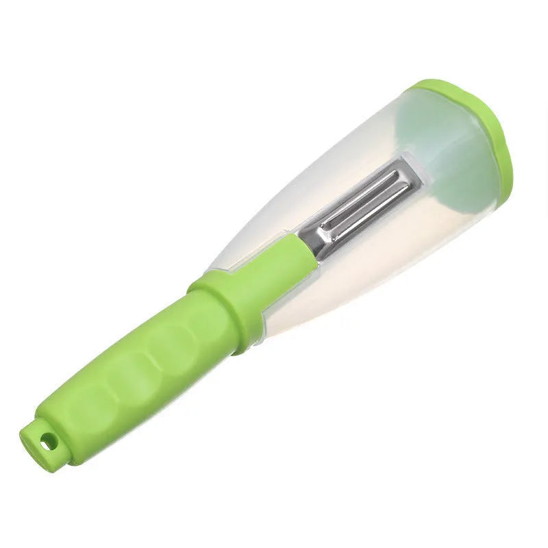 Green vegetable peeler with a transparent storage box attached, showing a stainless steel blade.