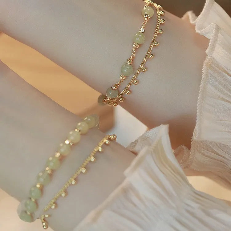 Handmade natural Hetian Jade women's bracelet in a classic beaded style.