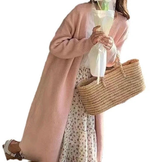 Women's knitted cardigan with V-neck and long sleeves in khaki colour, showing mid-length design