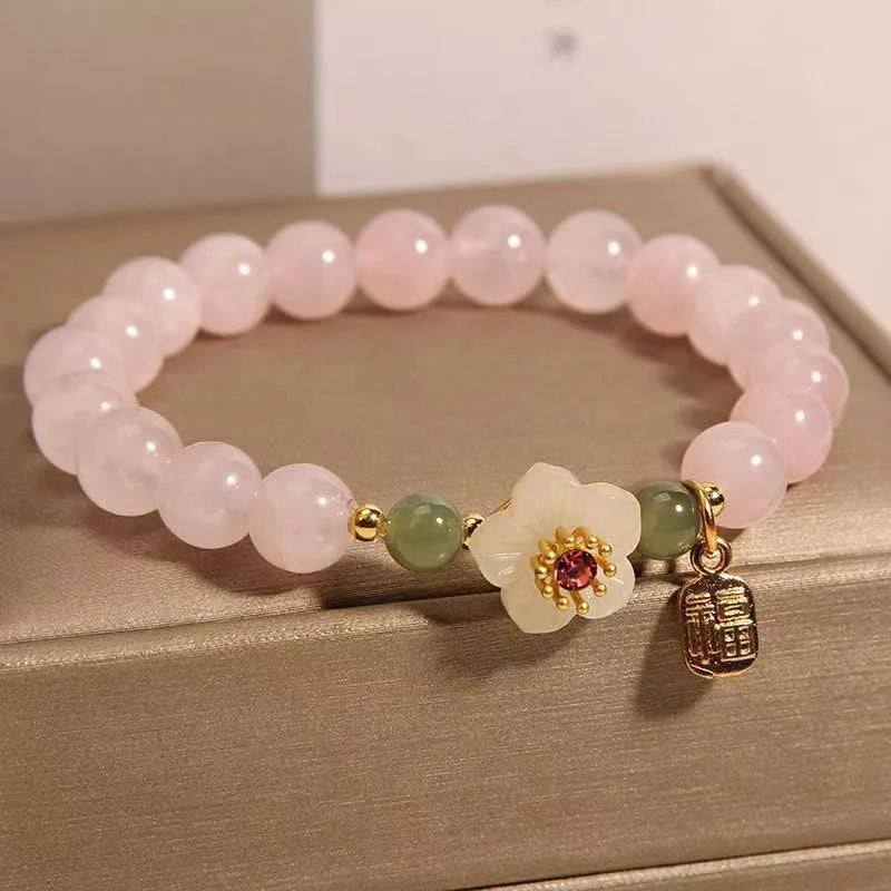 Crystal bracelet with Hetian jade elements and peach blossom design in blessing card colour