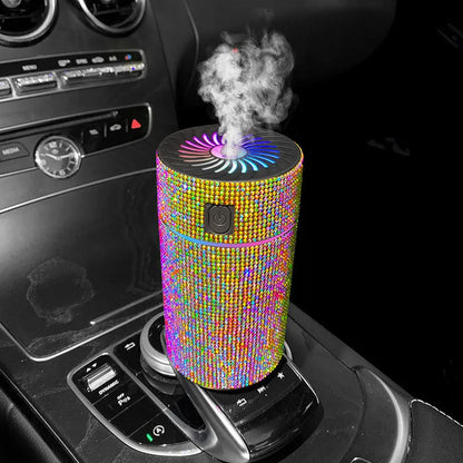 Compact white car air purifier and humidifier unit with USB cable on a car dashboard.