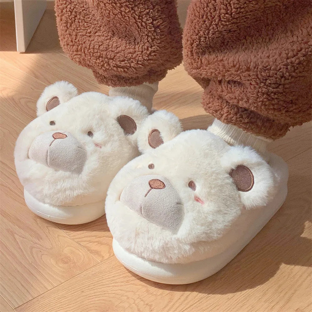 Women's cartoon-patterned suede plush slippers in milky white, shown with a rounded toe.
