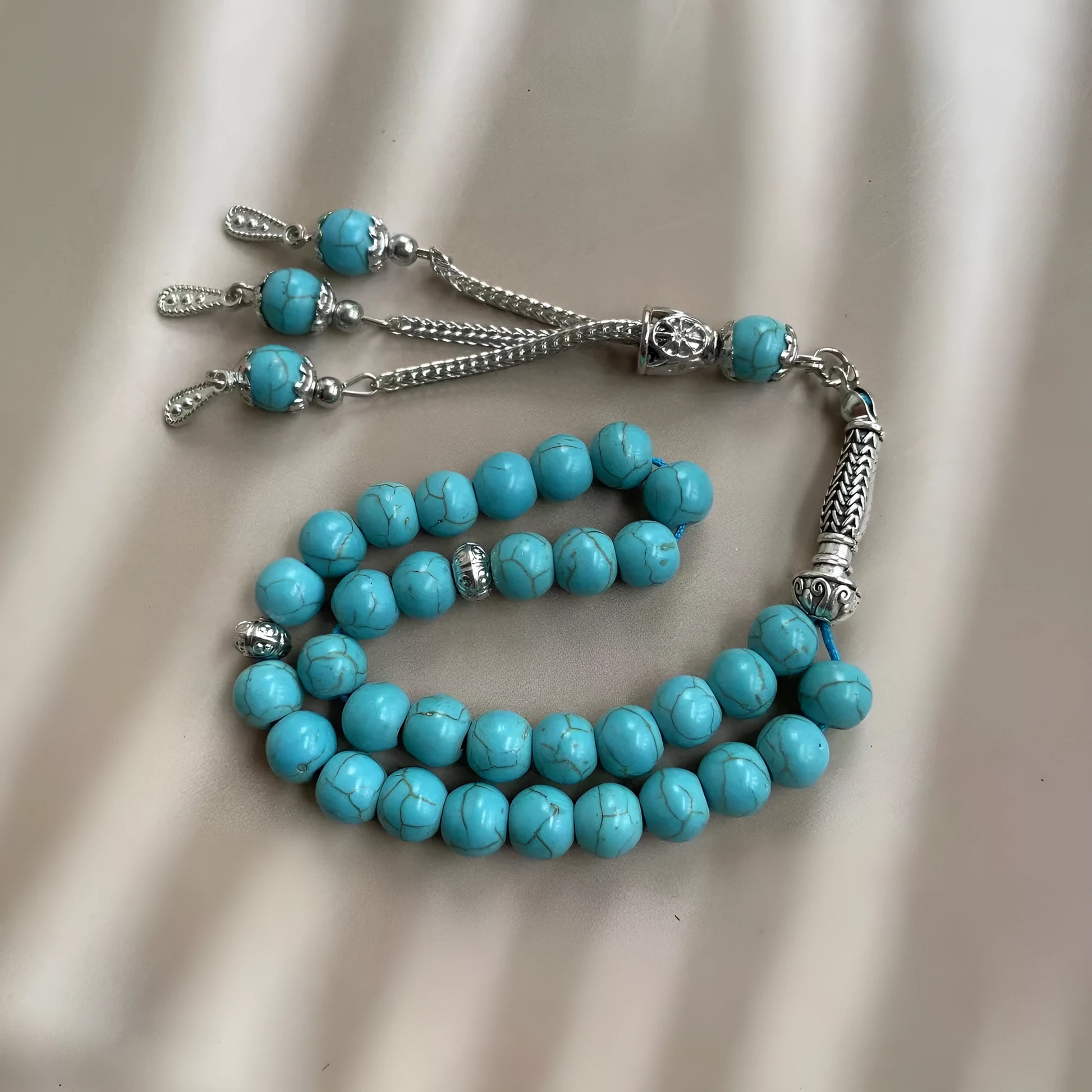 Sky blue stone bead Muslim prayer bracelet with 8mm beads on a single strand.