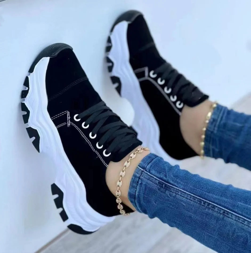 Women's platform sport flats in black, red, blue, and pink with lace-up design and thick sole