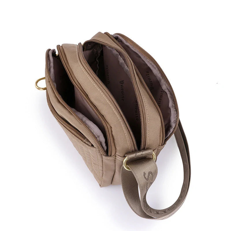 Compact nylon messenger bag for women in various colours with adjustable strap