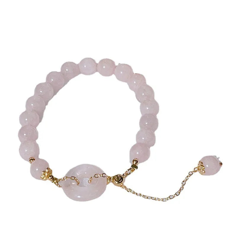 Pink crystal women's bracelet with peace buckle closure on adjustable band