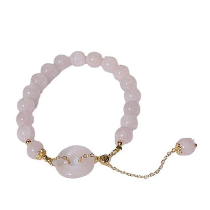 Pink crystal women's bracelet with peace buckle closure on adjustable band