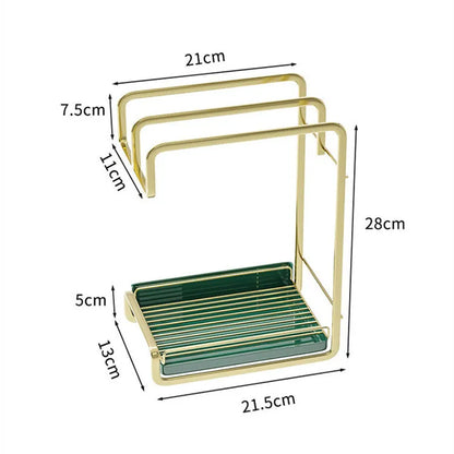 Gold wall mounted sponge holder with removable drip tray holding brushes and soap