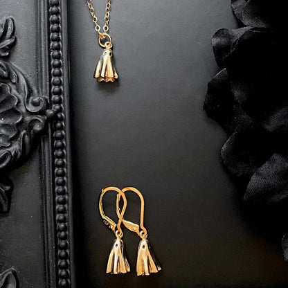 Ghost pendant necklace with titanium steel construction and electroplated finish on twisted chain
