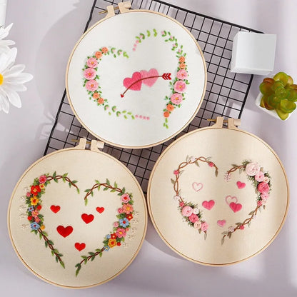 DIY Valentine's heart embroidery kit with cotton cloth and 20cm bamboo ring on a table.